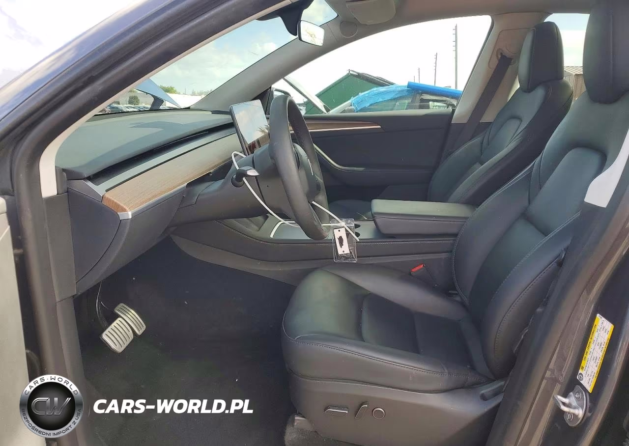 2023 Tesla Model Y VIN:7SAYGDEF4PF911501 - 7