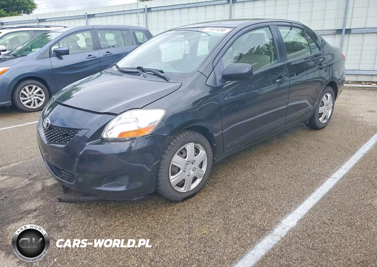 2009 Toyota Yaris Base VIN:JTDBT903194057411 - 1