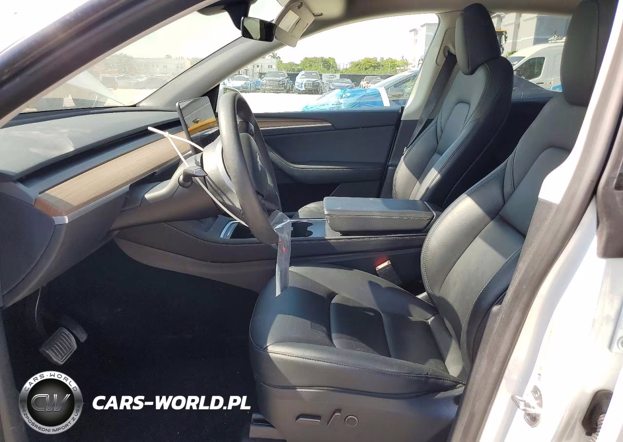 2023 Tesla Model Y VIN:7SAYGDEE7PF880185 - 7