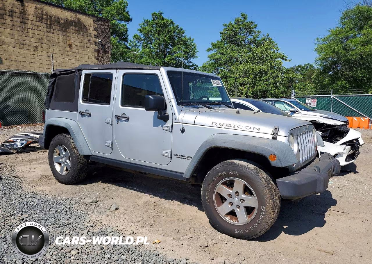 2011 Jeep Wrangler Unlimited Rubicon VIN:1J4BA6H13BL507895 - 4