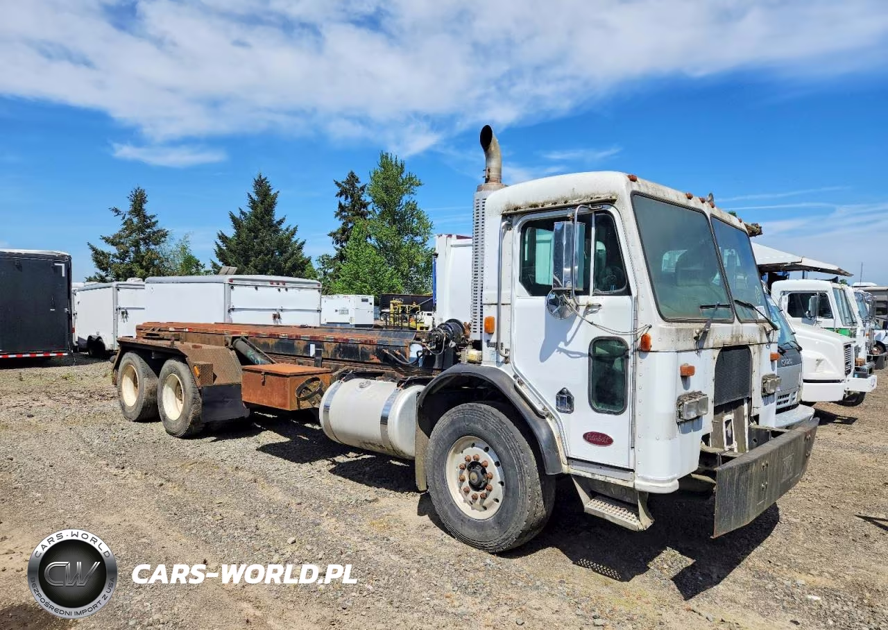2001 Peterbilt 320 Roll-Off Container Truck – zdjęcie 1 z 12