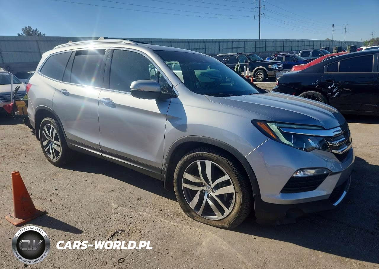 2018 Honda Pilot Elite VIN:5FNYF6H02JB069882 - 4