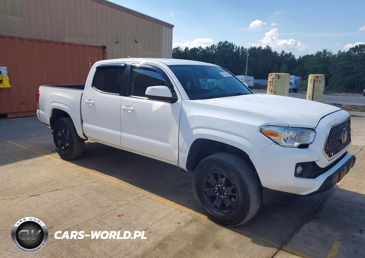 2018 Toyota Tacoma Sr VIN:5TFAX5GN5JX129357 - 4