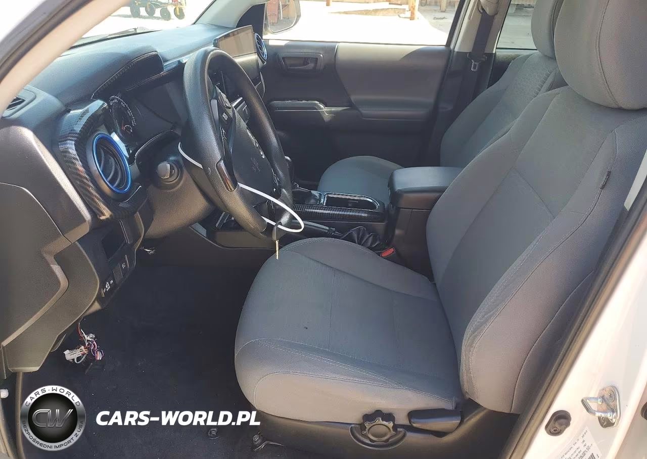 2018 Toyota Tacoma Sr VIN:5TFAX5GN5JX129357 - 7