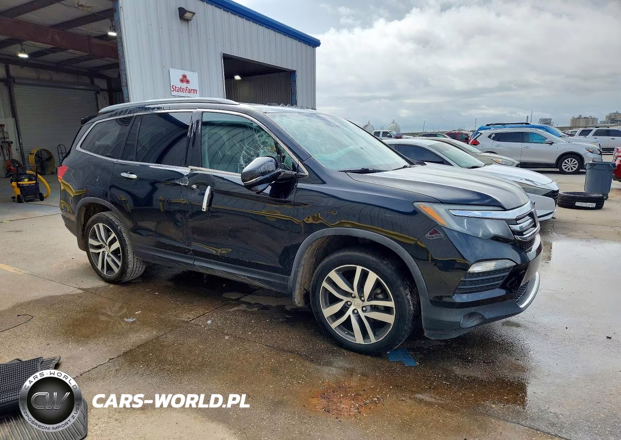 2018 Honda Pilot Touring VIN:5FNYF5H90JB009558 - 4