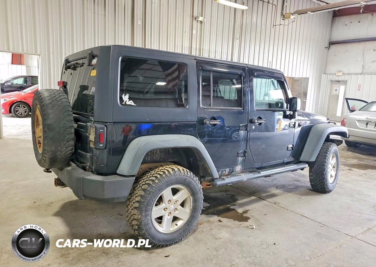 2011 Jeep Wrangler Unlimited Rubicon VIN:1J4HA6H16BL565252 - 3
