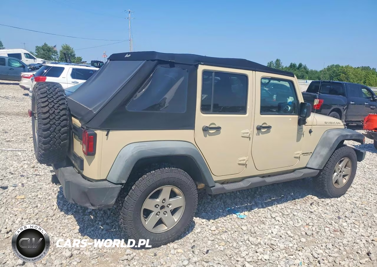 2011 Jeep Wrangler Unlimited Rubicon VIN:1J4BA6H13BL598053 - 3