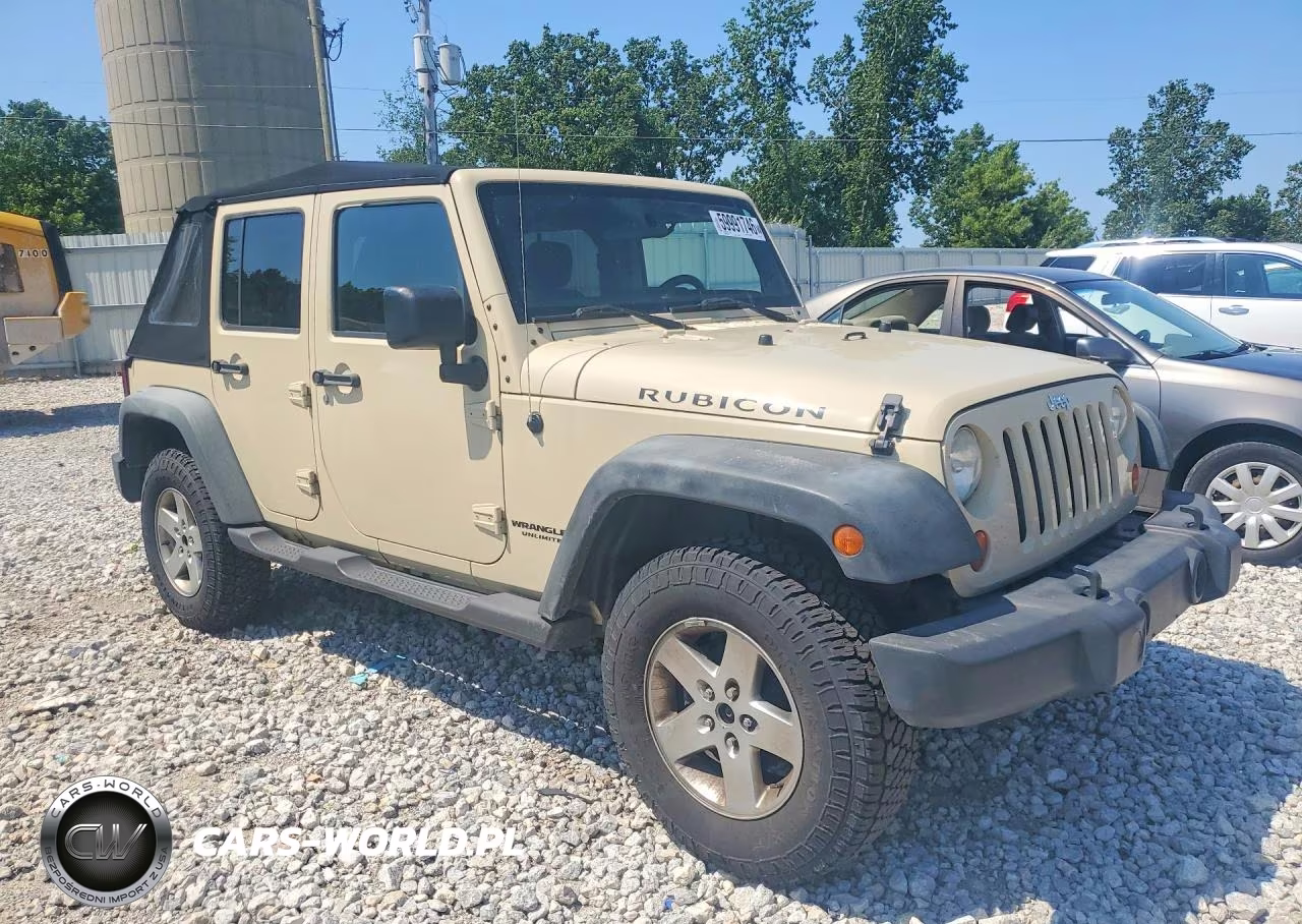 2011 Jeep Wrangler Unlimited Rubicon VIN:1J4BA6H13BL598053 - 4