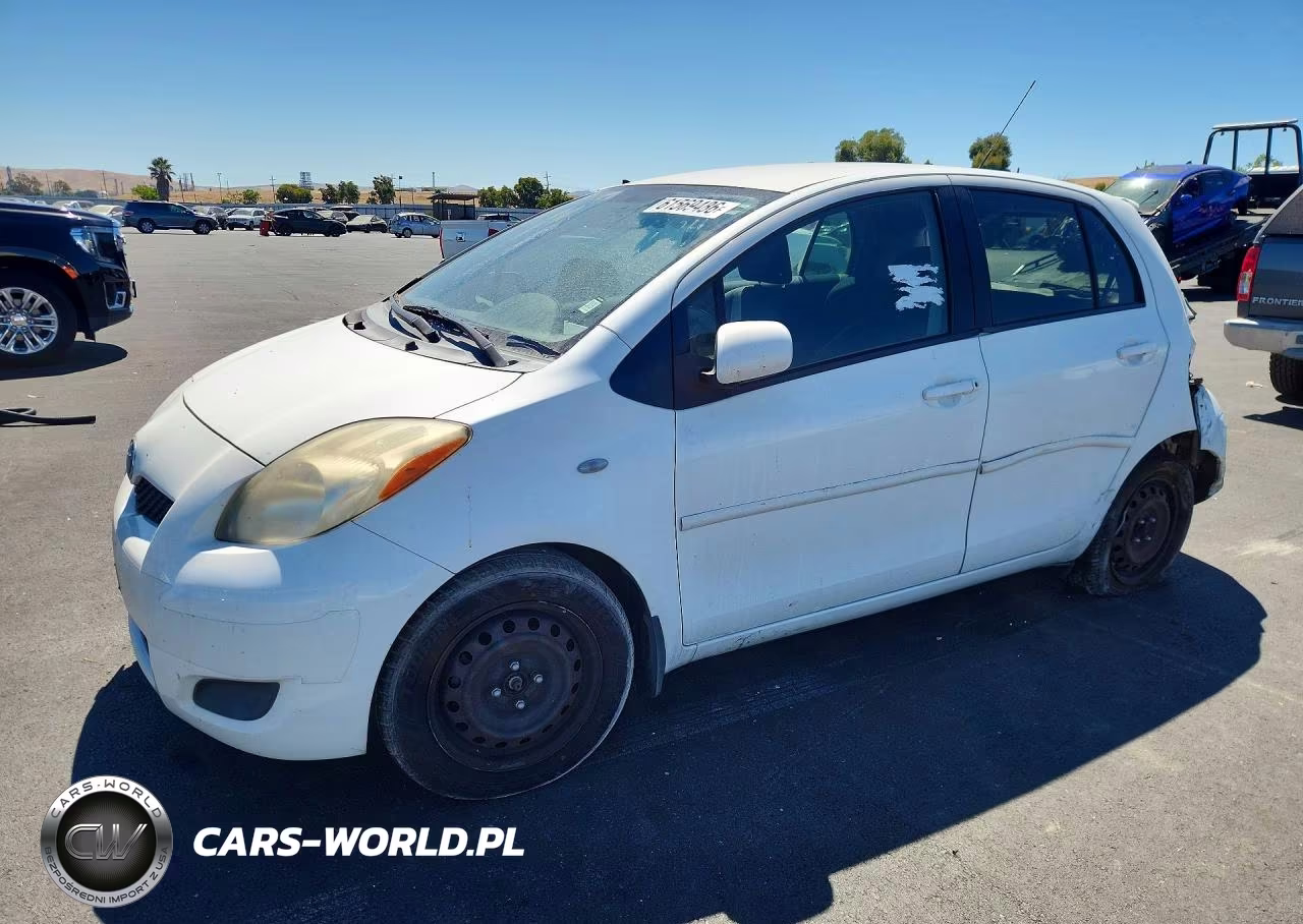 2009 Toyota Yaris Base VIN:JTDKT903995223801 - 1