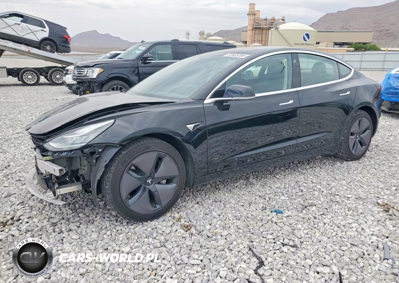 2018 Tesla Model 3 VIN:5YJ3E1EAXJF042216 - 1