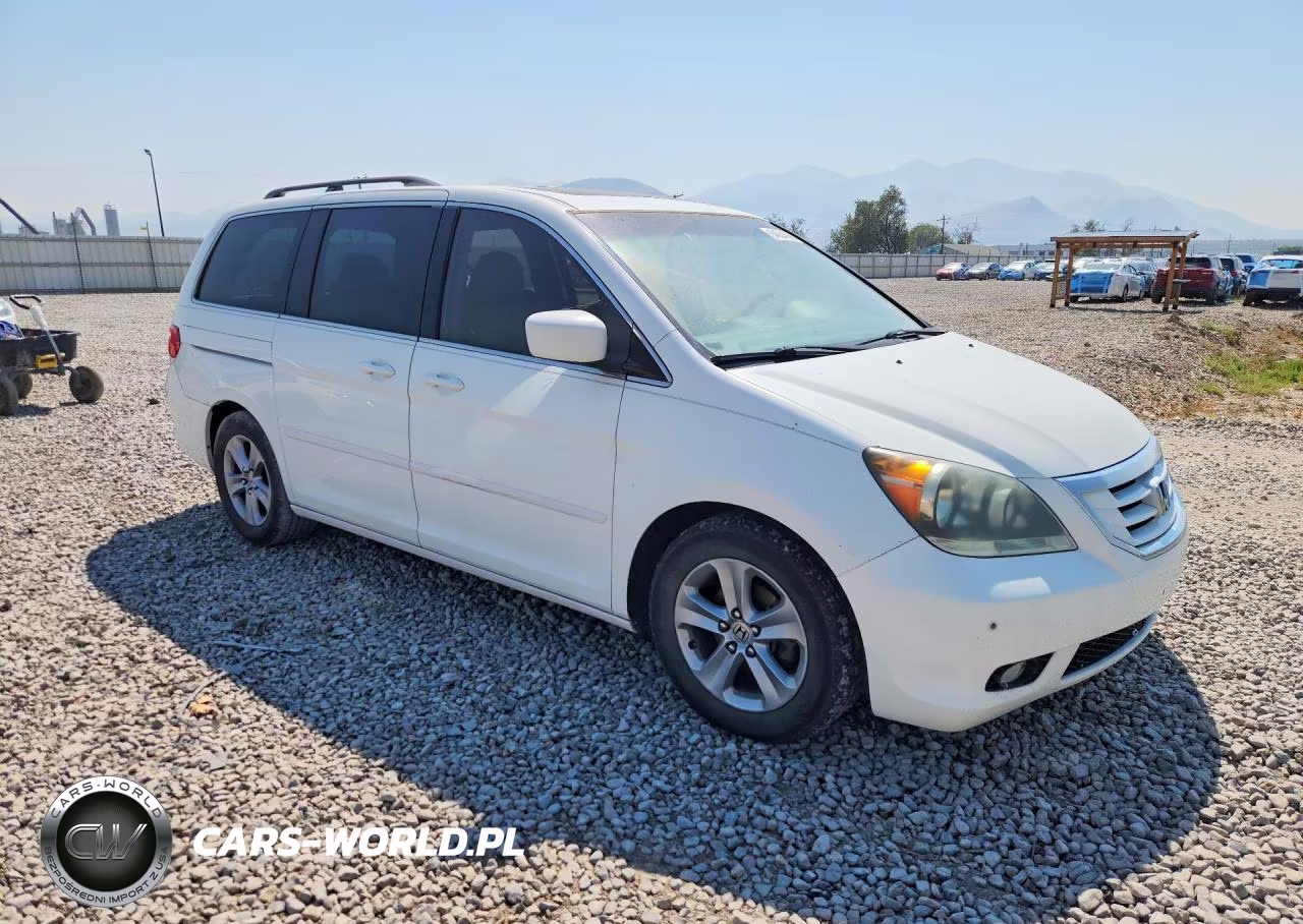 2010 Honda Odyssey Touring VIN:5FNRL3H90AB047342 - 4