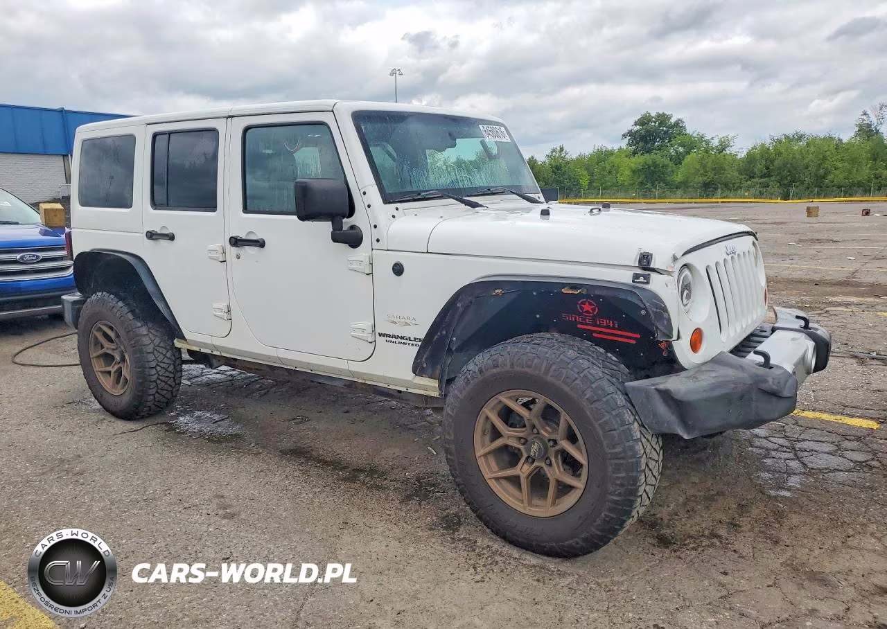 2011 Jeep Wrangler Unlimited Sahara VIN:1J4BA5H15BL576212 - 4