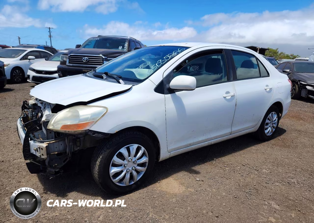 2011 Toyota Yaris Base VIN:JTDBT4K30B1400457 - 1