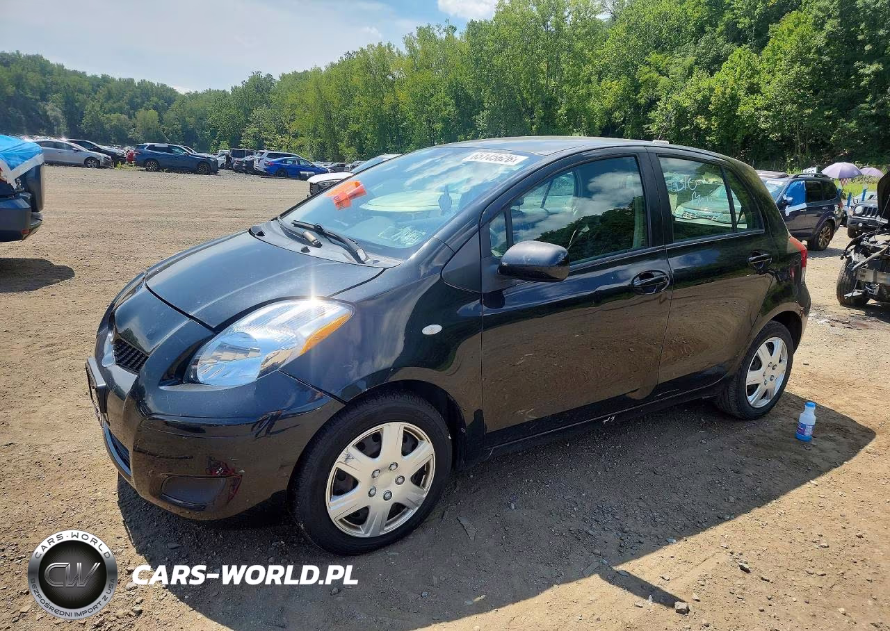 2009 Toyota Yaris Base VIN:JTDKT903495258052 - 1