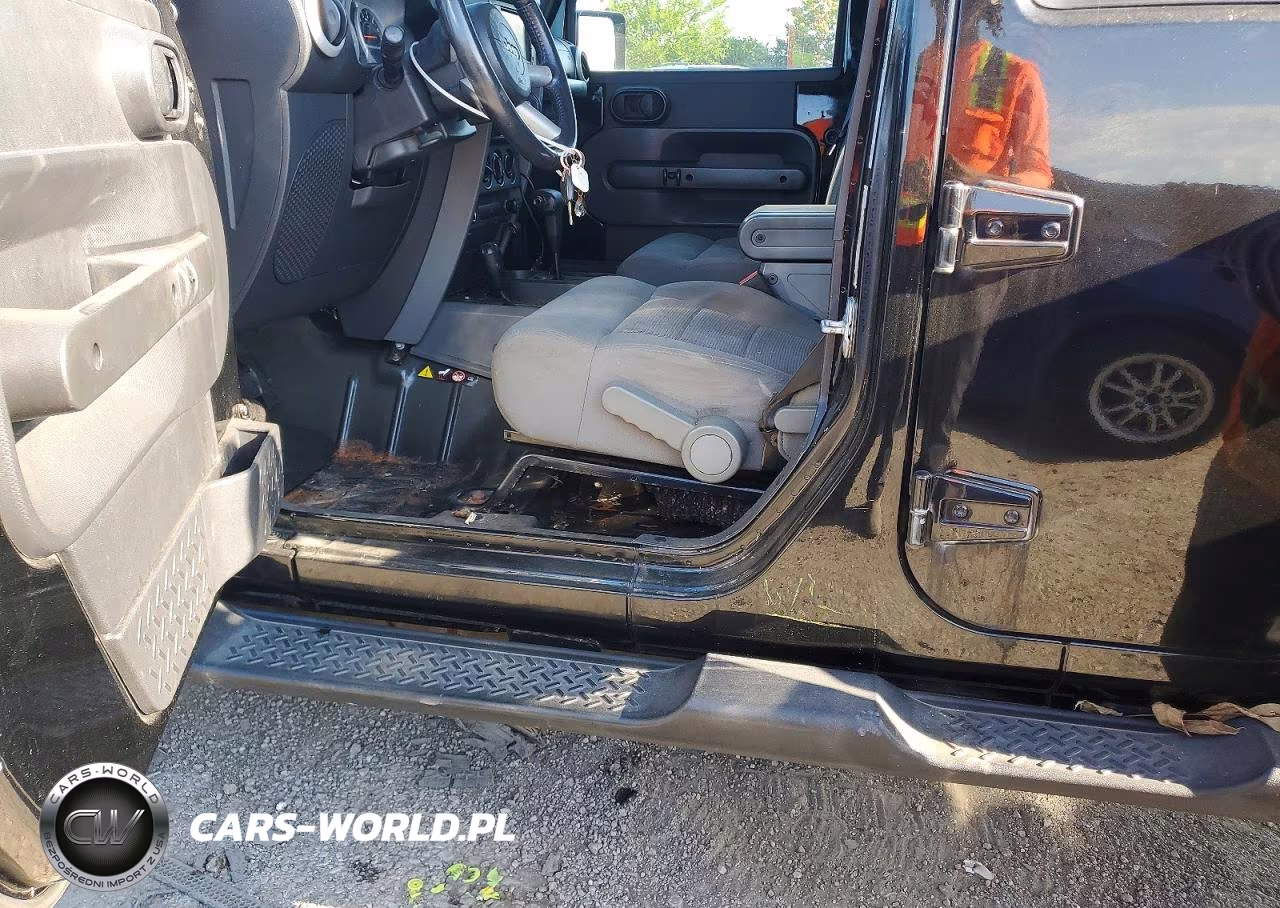 2009 Jeep Wrangler Unlimited Sahara VIN:1J4GA59109L769608 - 13