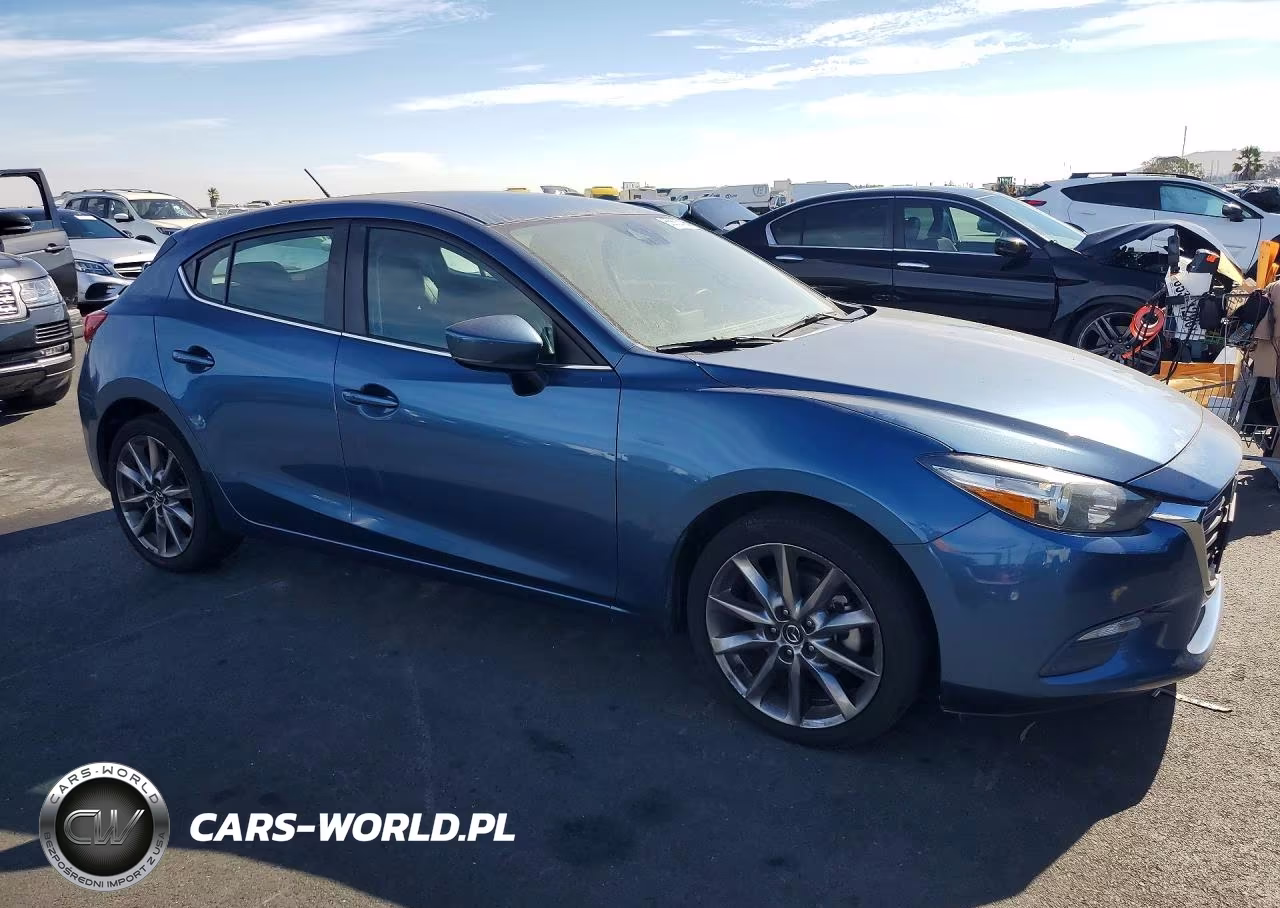 2018 Mazda 3 Touring VIN:3MZBN1L34JM178107 - 4