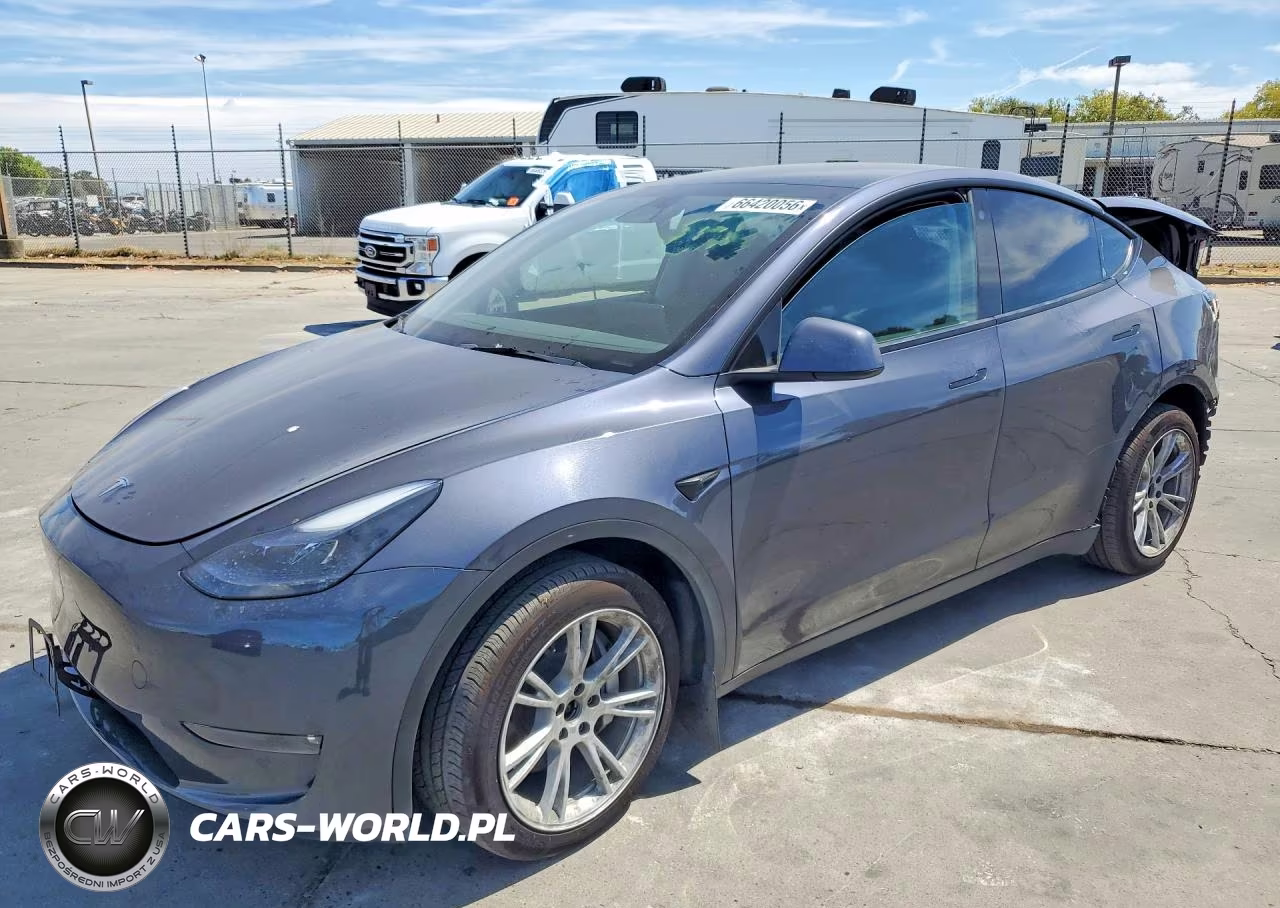 2023 Tesla Model Y VIN:7SAYGAEE0PF738551 - 1