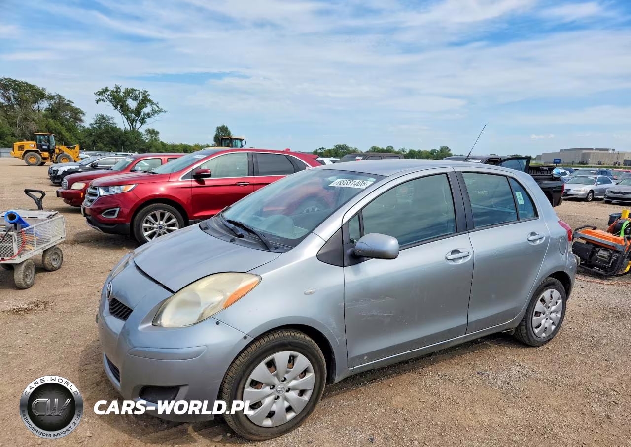 2009 Toyota Yaris Base VIN:JTDKT903595222743 - 1