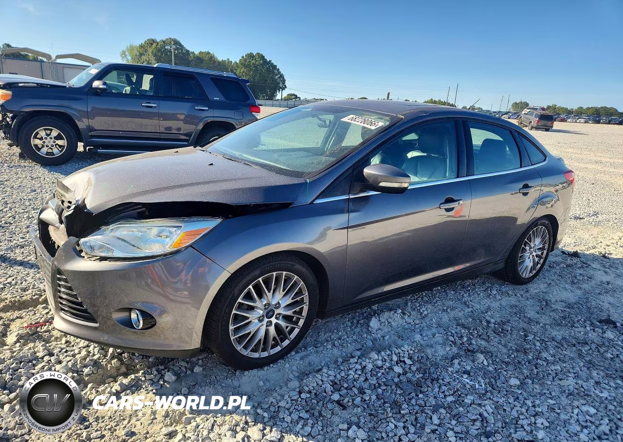 2014 Ford Focus Titanium VIN:1FADP3J20EL338931 - 1