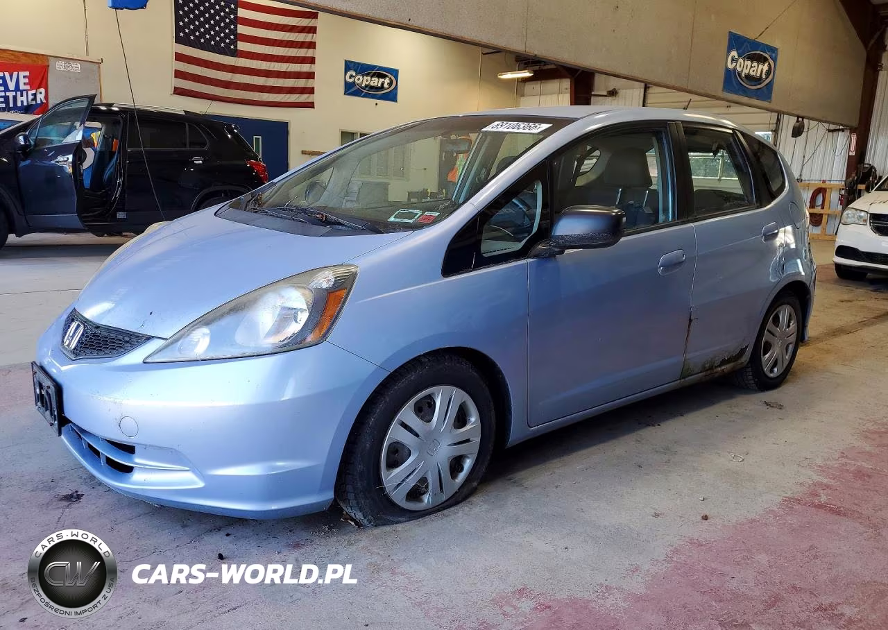 2009 Honda Fit VIN:JHMGE87209S034526 - 1