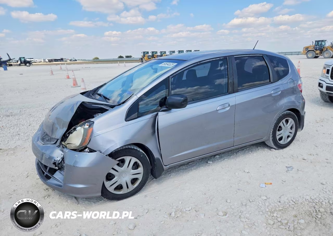 2009 Honda Fit VIN:JHMGE88299C002179 - 1