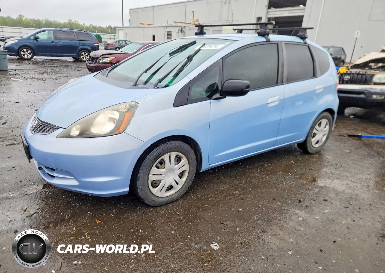 2009 Honda Fit VIN:JHMGE88239C006325 - 1