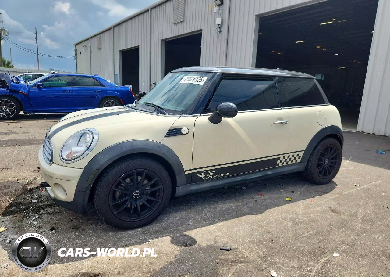 2009 Mini Cooper VIN:WMWMF33559TU75225 - 1