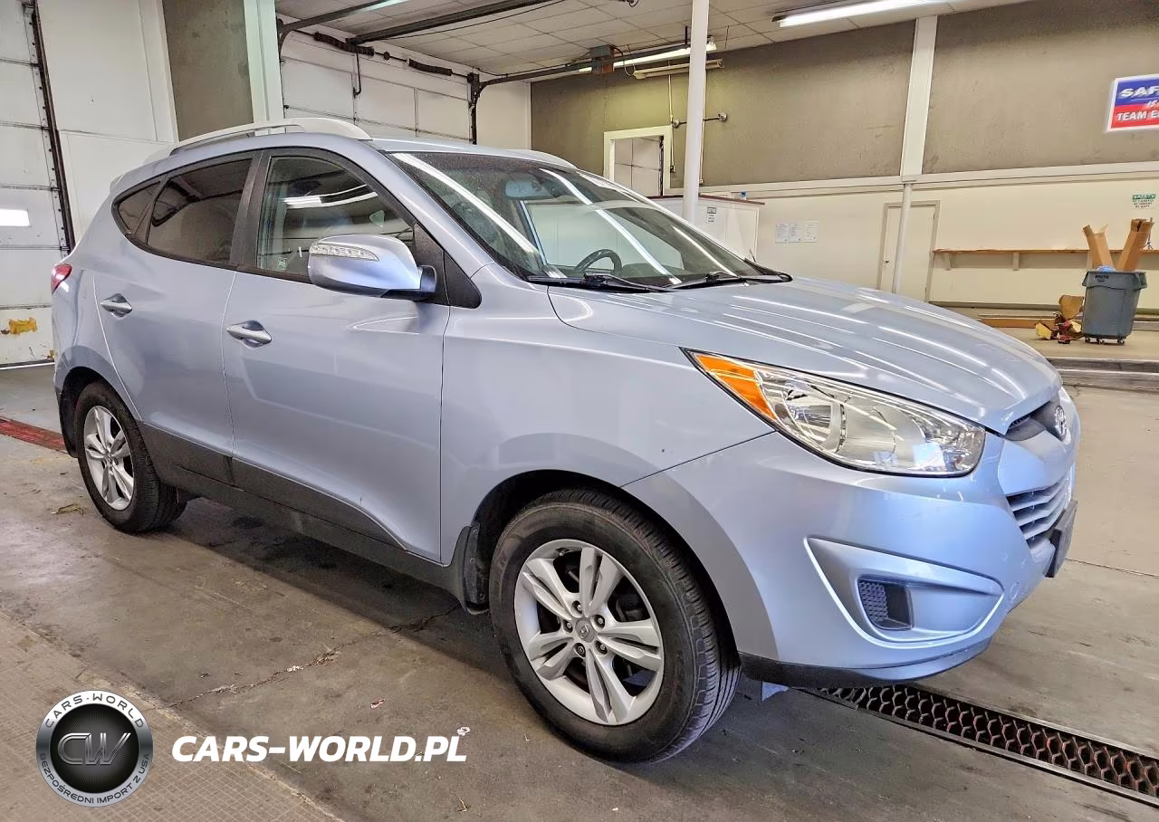 2012 Hyundai Tucson VIN:KM8JUCAC1CU396547 - 4