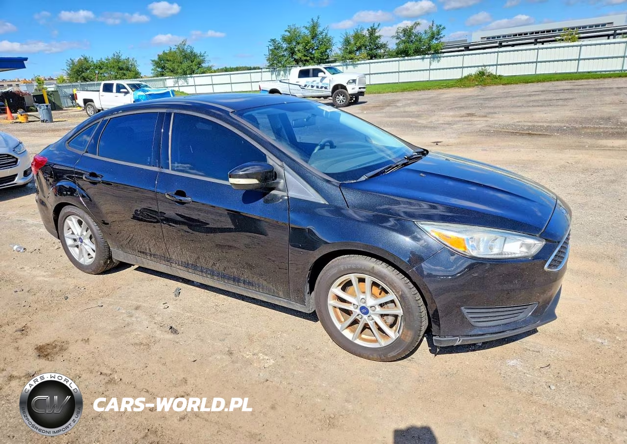 2015 Ford Focus 4D VIN:1FADP3F29FL253452 - 4