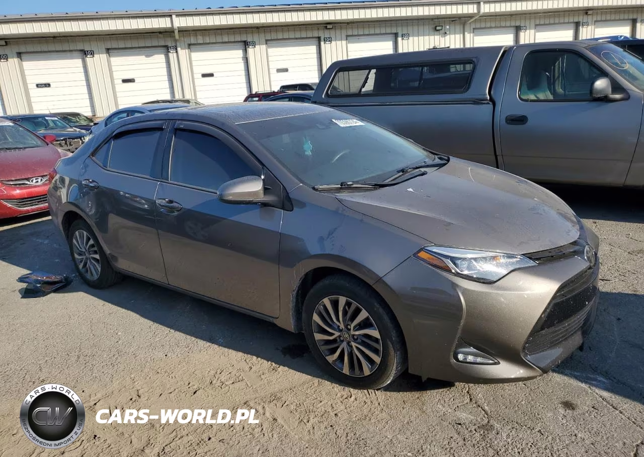 2018 Toyota Corolla L VIN:5YFBURHE0JP831605 - 4