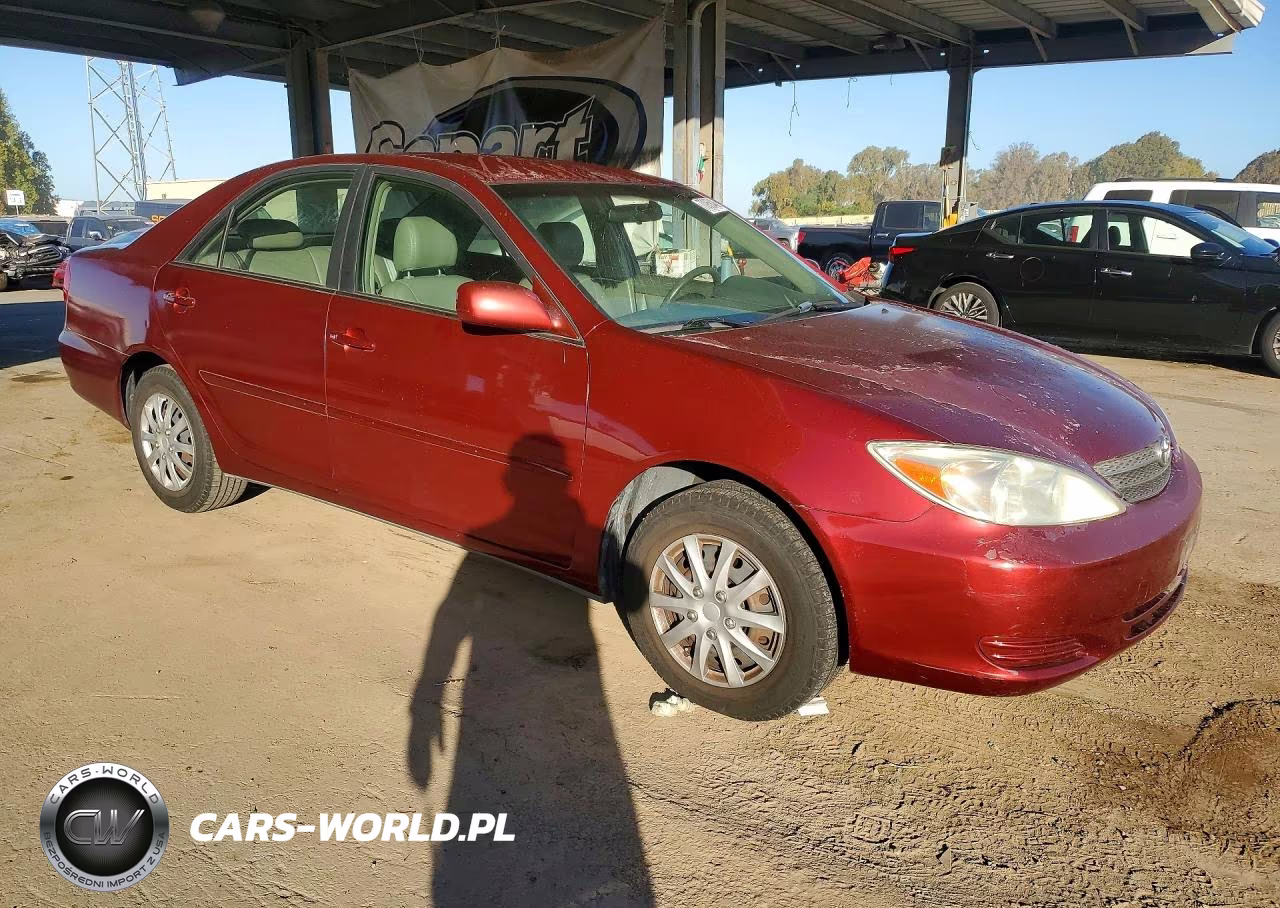 2002 Toyota Camry Le VIN:JTDBE32K020092420 - 4