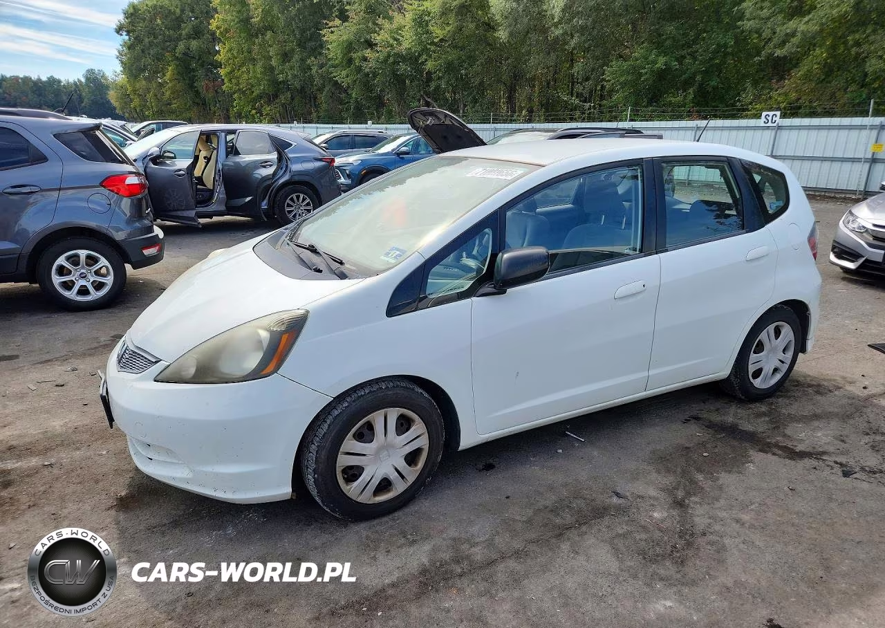 2009 Honda Fit VIN:JHMGE88239S024412 - 1