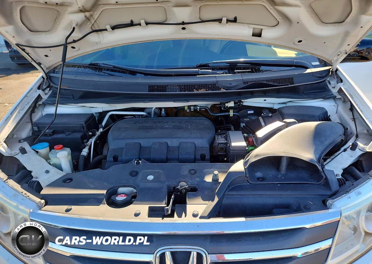 2012 Honda Odyssey Touring VIN:5FNRL5H9XCB009728 - 12