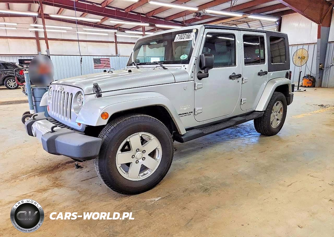 2010 Jeep Wrangler Unlimited Sahara VIN:1J4HA5H11AL221028 - 1