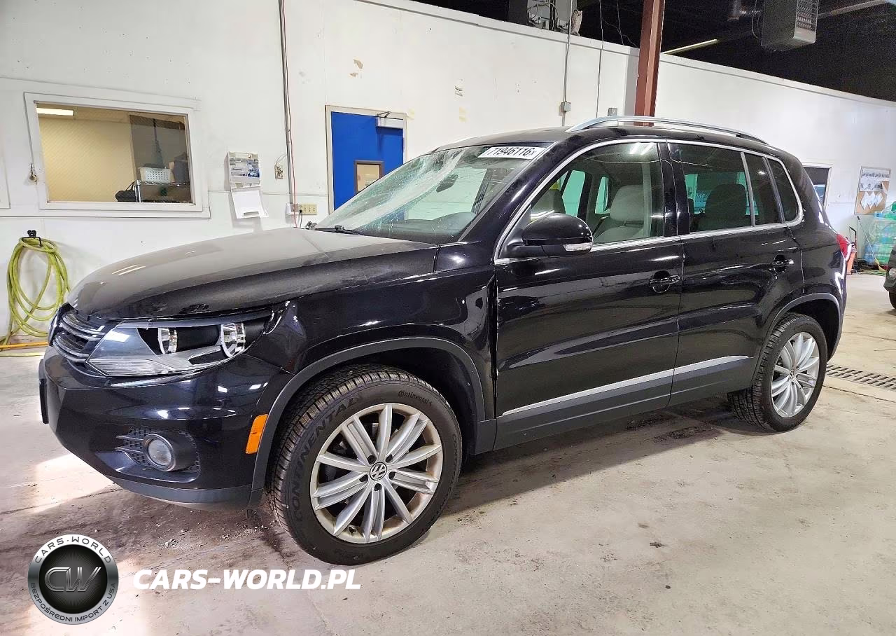 2014 Volkswagen Tiguan S VIN:WVGBV3AX0EW606566 - 1