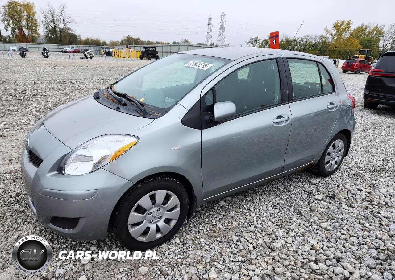 2009 Toyota Yaris Base VIN:JTDKT903995244017 - 1