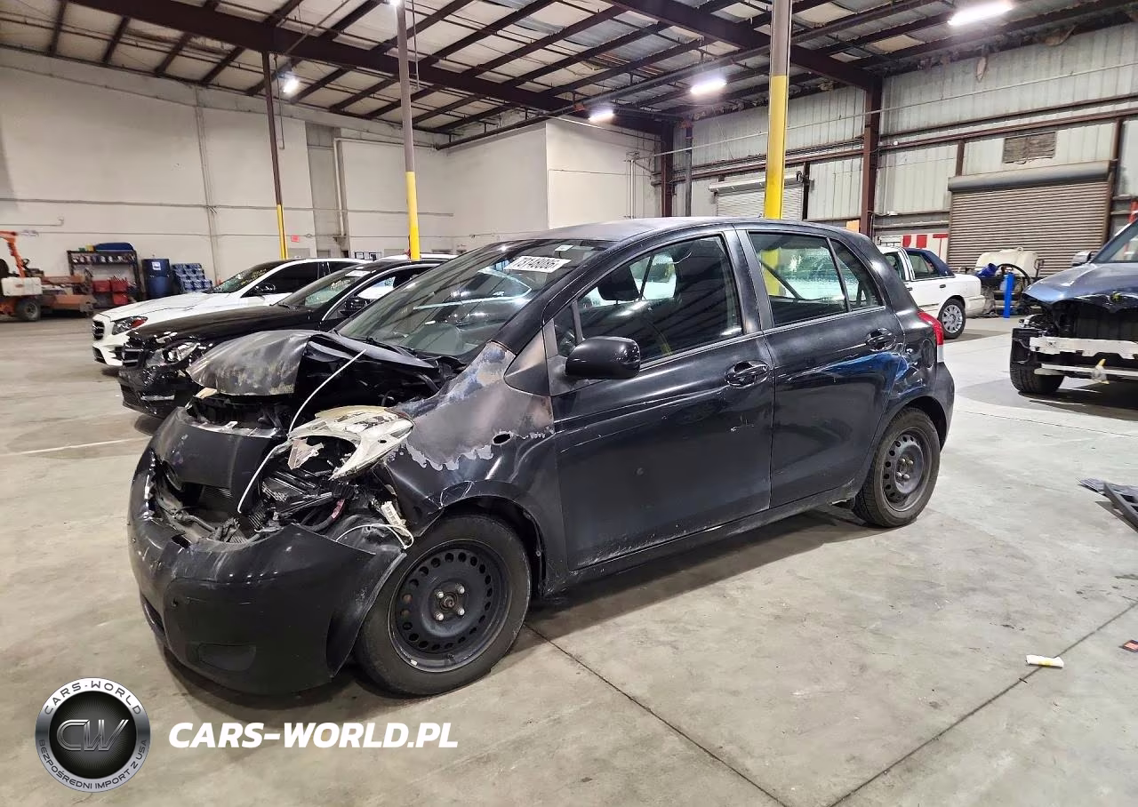 2011 Toyota Yaris Base VIN:JTDKT4K31B5329357 - 1