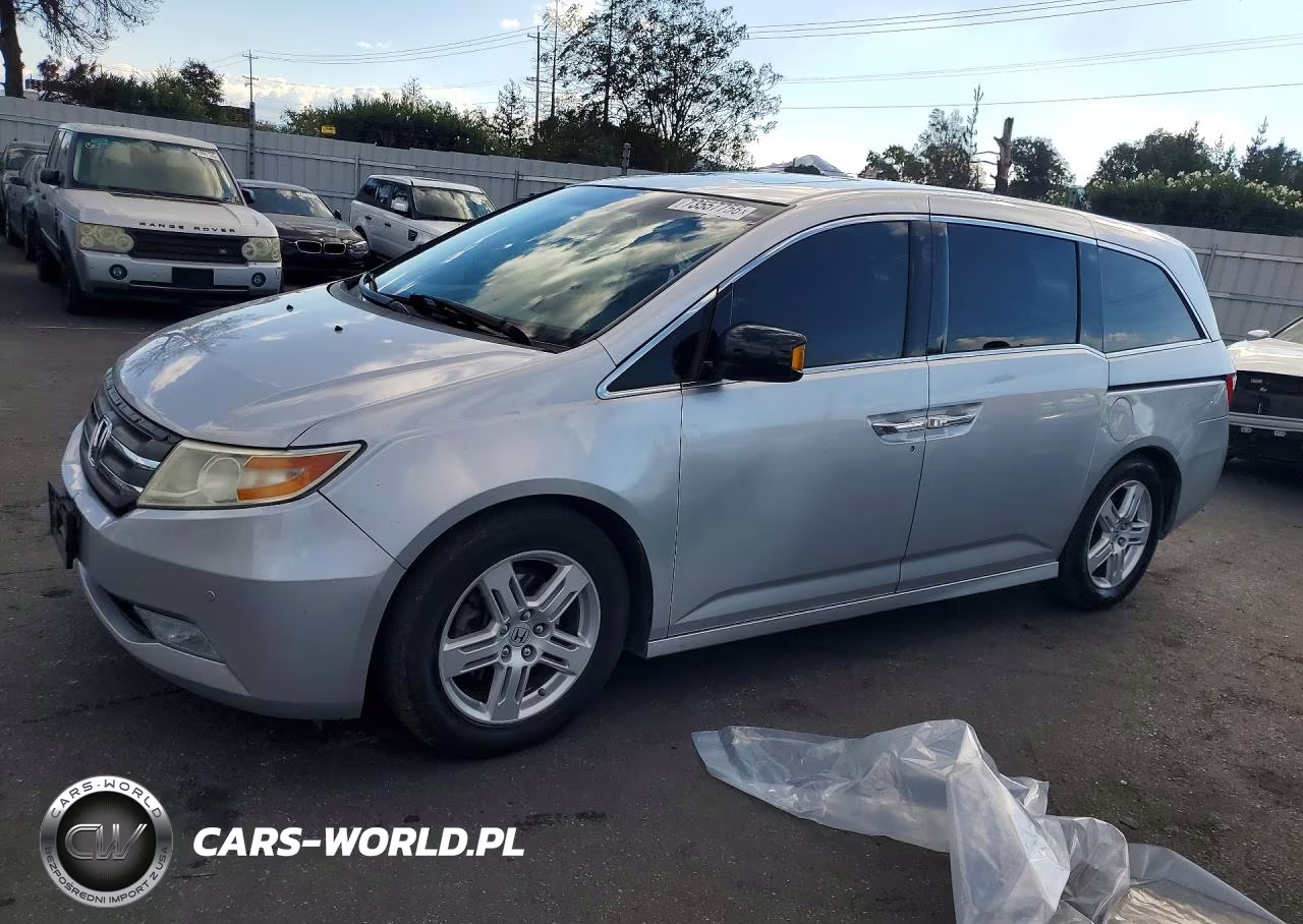 2012 Honda Odyssey Touring VIN:5FNRL5H90CB128324 - 1