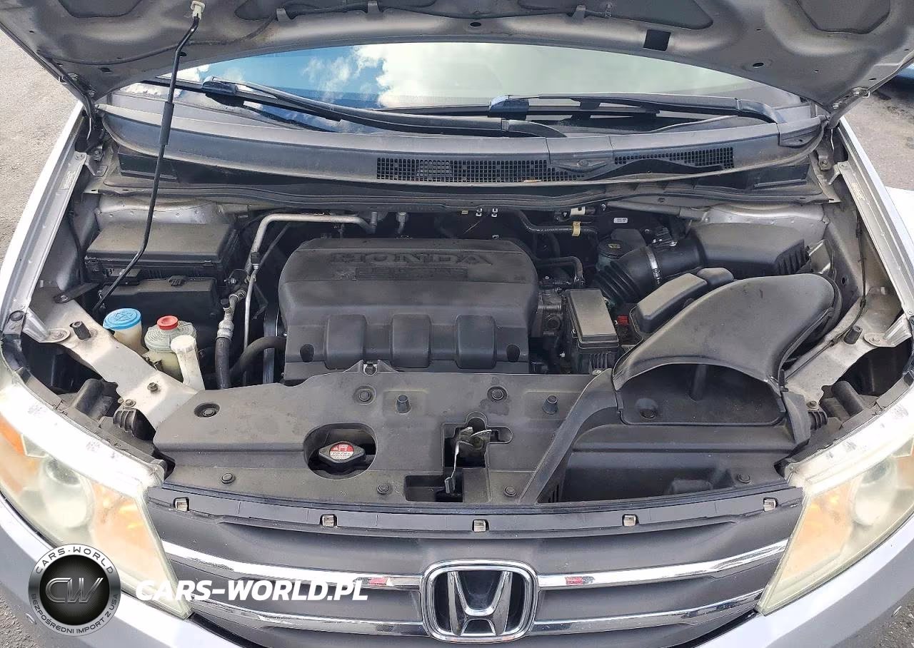 2012 Honda Odyssey Touring VIN:5FNRL5H90CB128324 - 12
