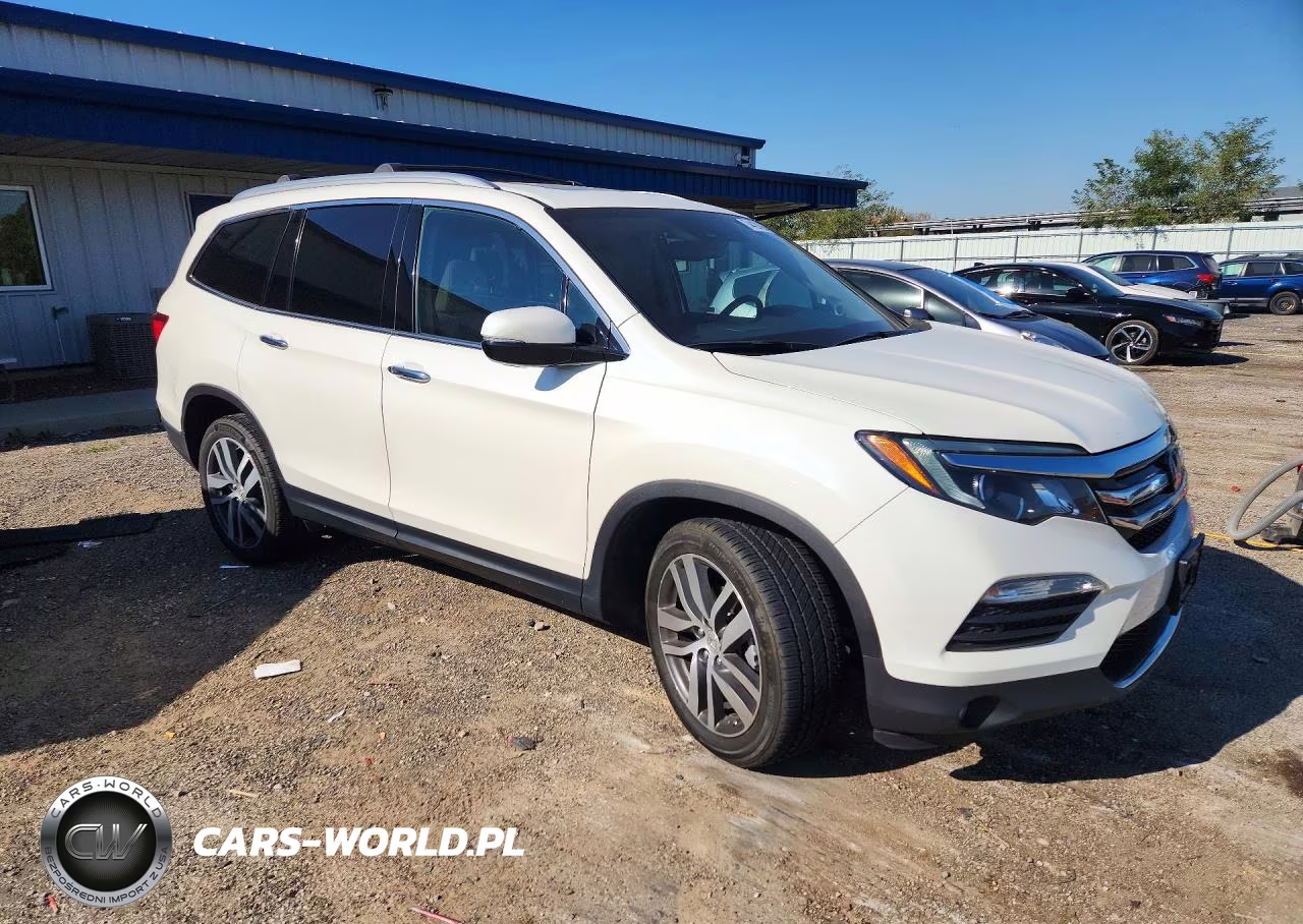 2018 Honda Pilot Elite VIN:5FNYF6H06JB060697 - 4