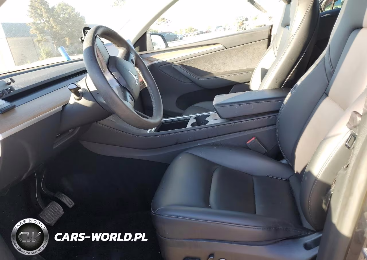 2023 Tesla Model Y VIN:7SAYGDEE8PA128427 - 7