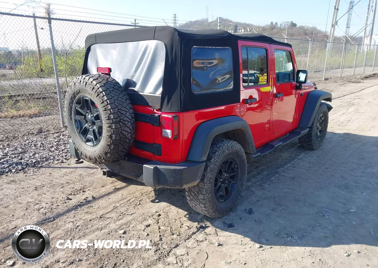 2015 Jeep Wrangler Unlimited Willys Wheeler VIN:1C4BJWDG7FL670717 - 4