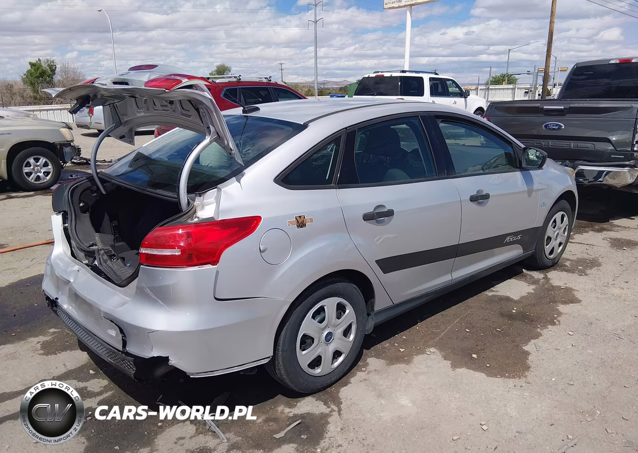 2015 Ford Focus S VIN:1FADP3E21FL220396 - 4