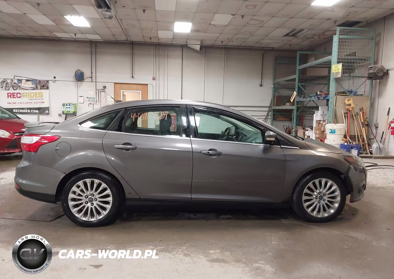 2012 Ford Focus Titanium VIN:1FAHP3J21CL292265 - 13