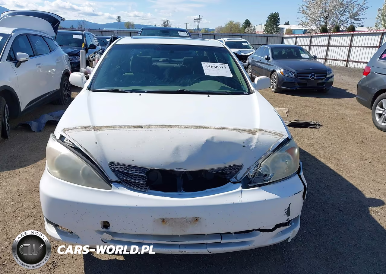 2002 Toyota Camry Le VIN:JTDBE30K120025487 - 12