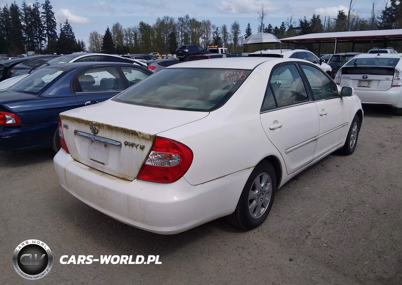 2004 Toyota Camry Le VIN:JTDBE32K340274955 - 4