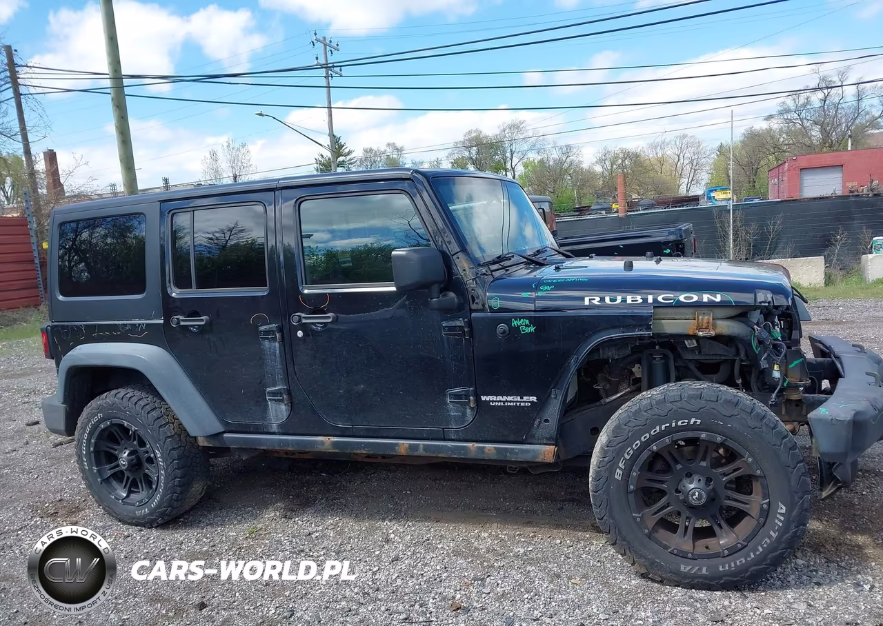 2011 Jeep Wrangler Unlimited Rubicon VIN:1J4BA6H16BL543001 - 13