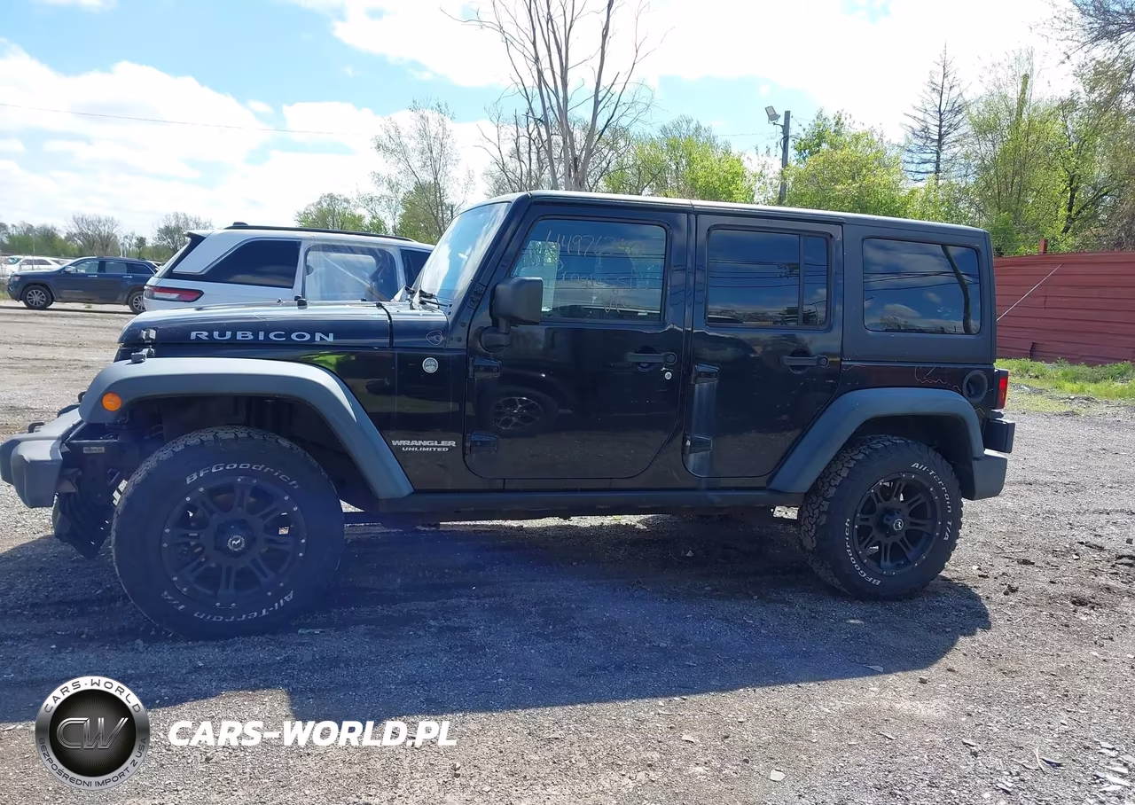 2011 Jeep Wrangler Unlimited Rubicon VIN:1J4BA6H16BL543001 - 14