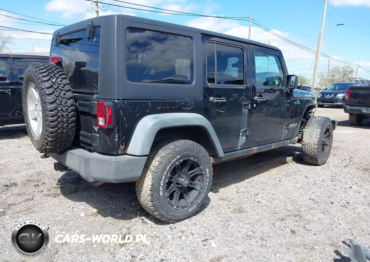 2011 Jeep Wrangler Unlimited Rubicon VIN:1J4BA6H16BL543001 - 4