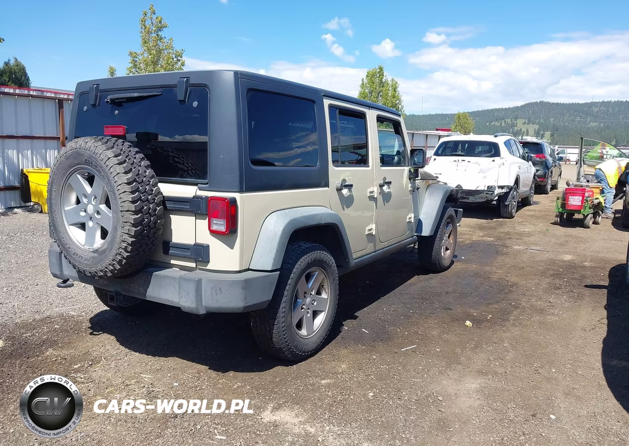 2011 Jeep Wrangler Unlimited Rubicon VIN:1J4BA6H13BL573752 - 4